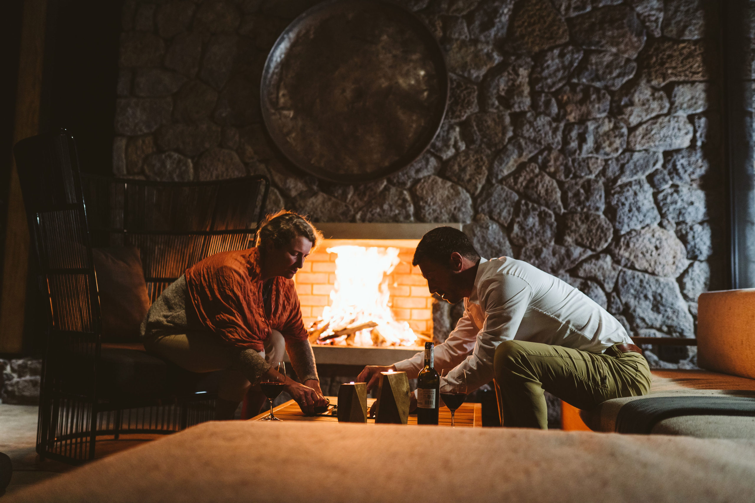 a couple by a fire